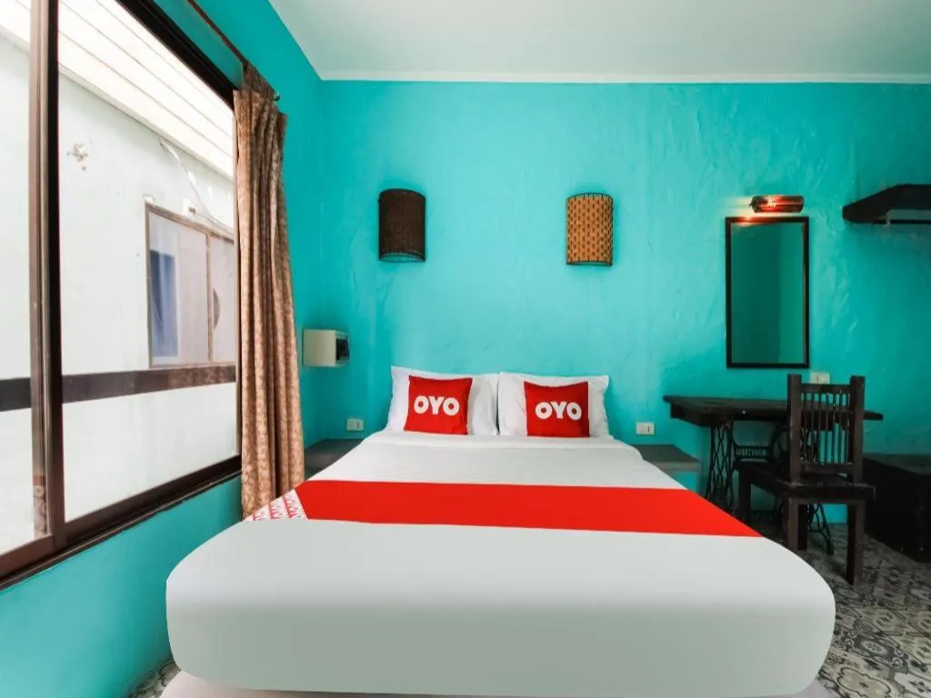 Bed in OYO 1103 Pirates House Hotel