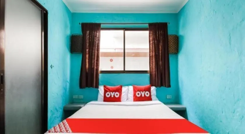 Bed in OYO 1103 Pirates House Hotel