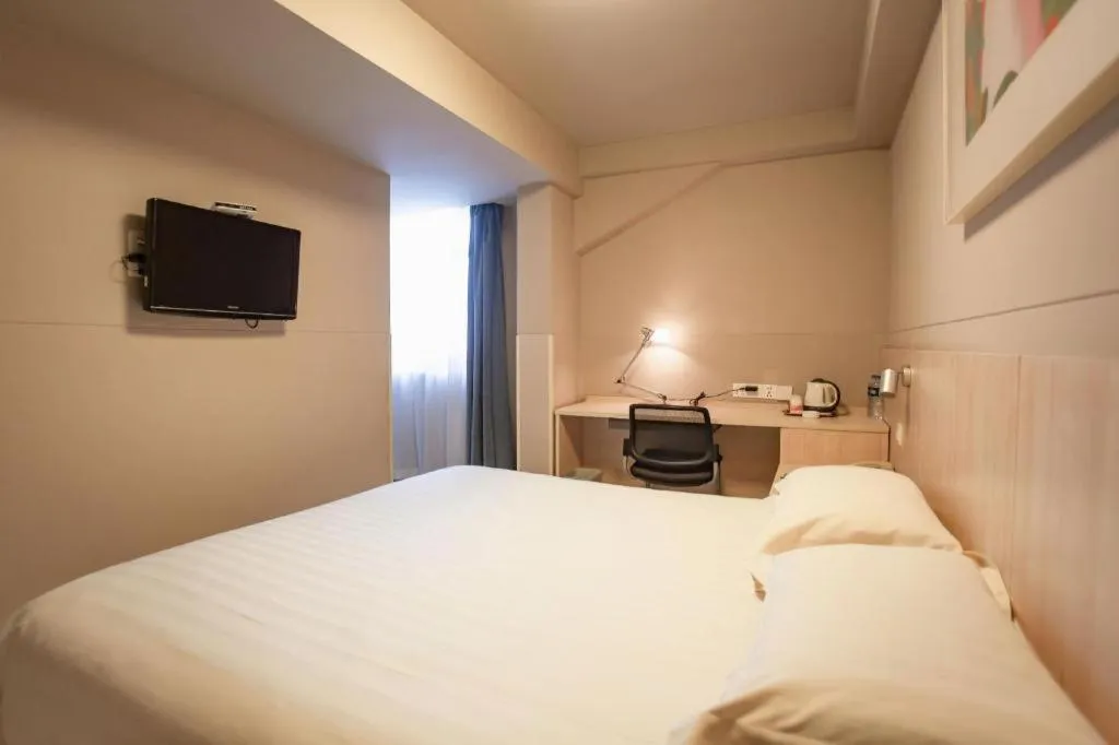 Bed in Jinjiang Inn Wuhu Fangte Tech Museum Metro Station