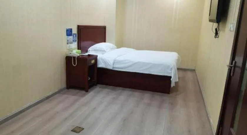 Bed in GreenTree Inn Suzhou Shengze Hotel