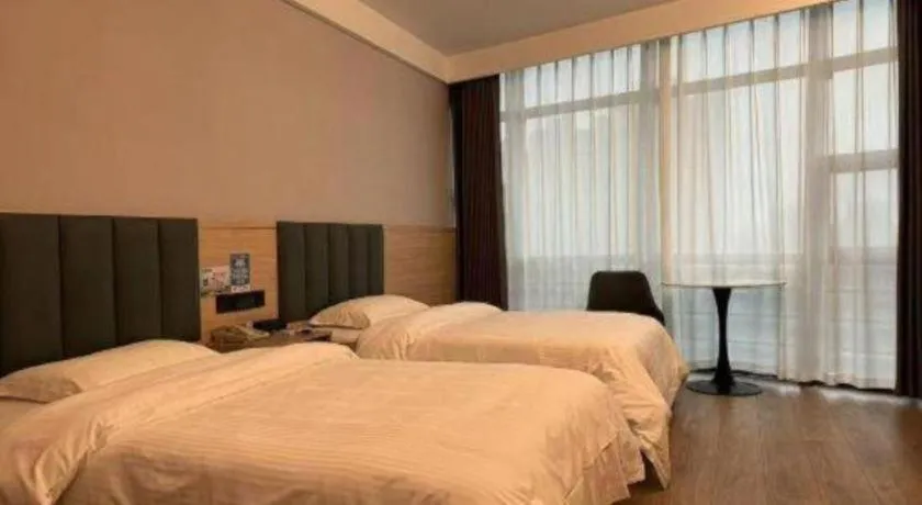 Bed in GreenTree Inn Suzhou Shengze Hotel