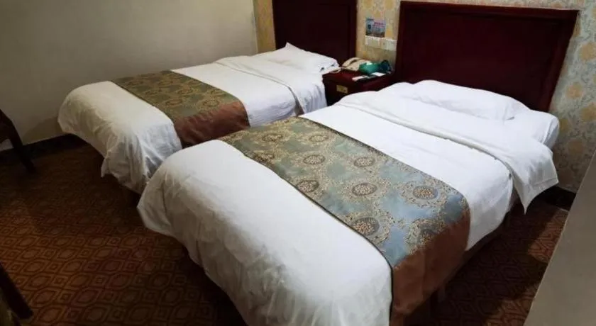 Bed in GreenTree Inn Suzhou Shengze Hotel