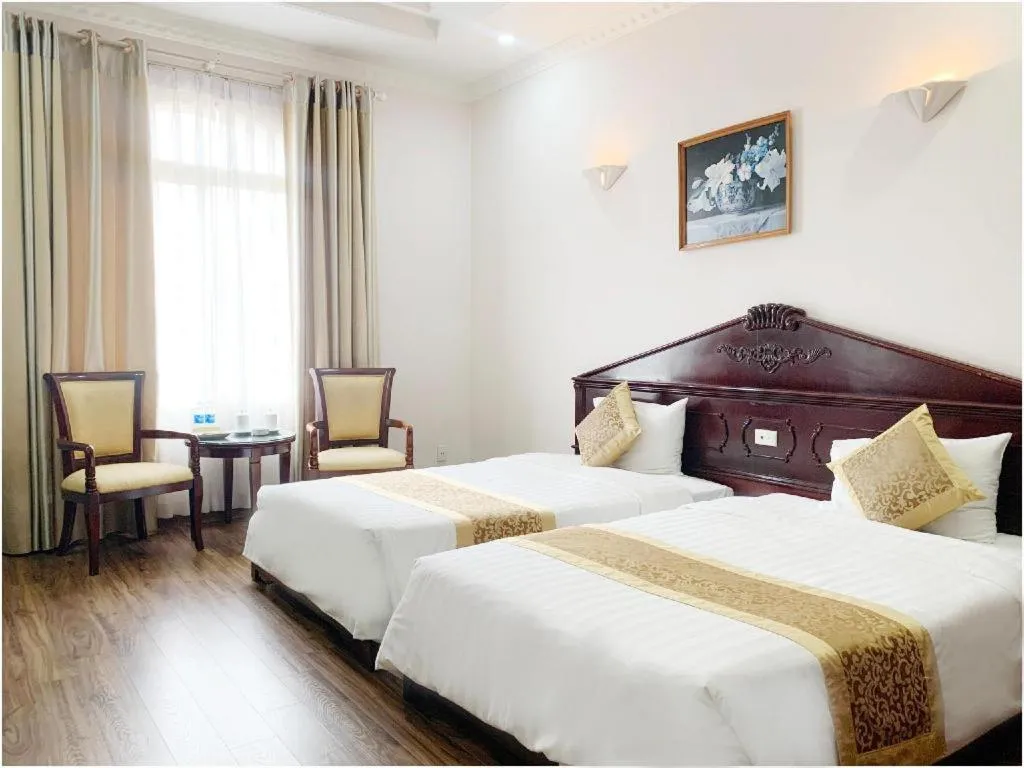 Bed in Cong Doan Viet Nam Hotel