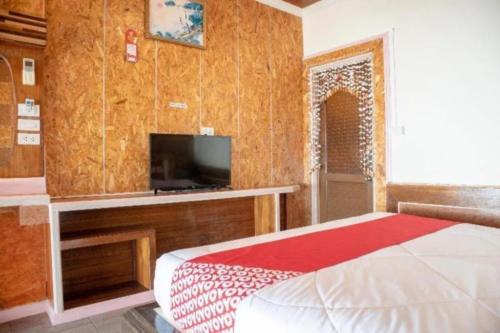 Bed in OYO 797 Pink House Bungalow