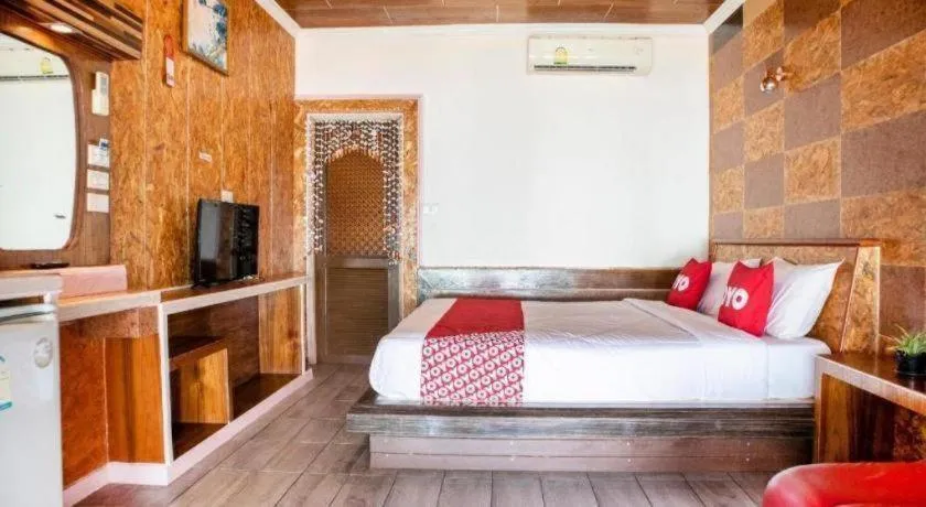 Bed in OYO 797 Pink House Bungalow