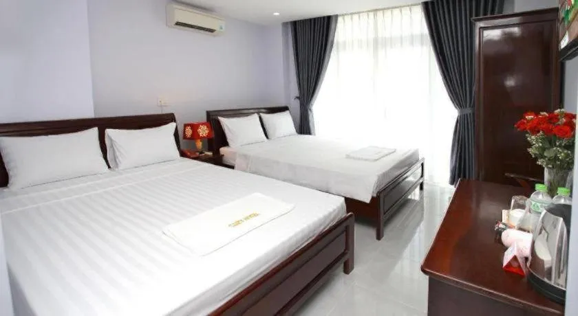 Bed in Nhatrang Cozy Hotel