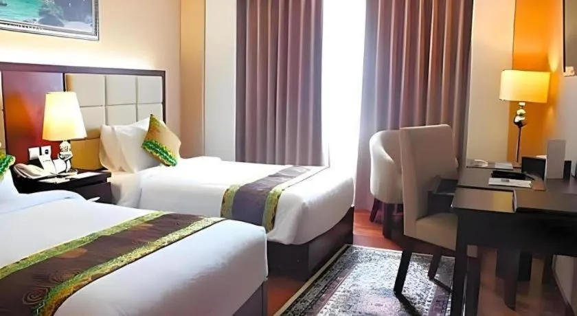 Bed in Grand Qin Hotel Syariah