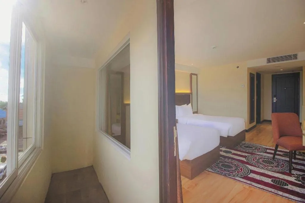 Bed in Grand Qin Hotel Syariah