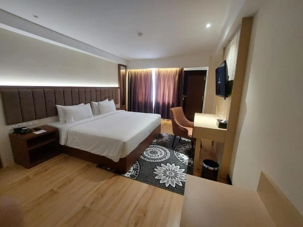 Bed in Grand Qin Hotel Syariah