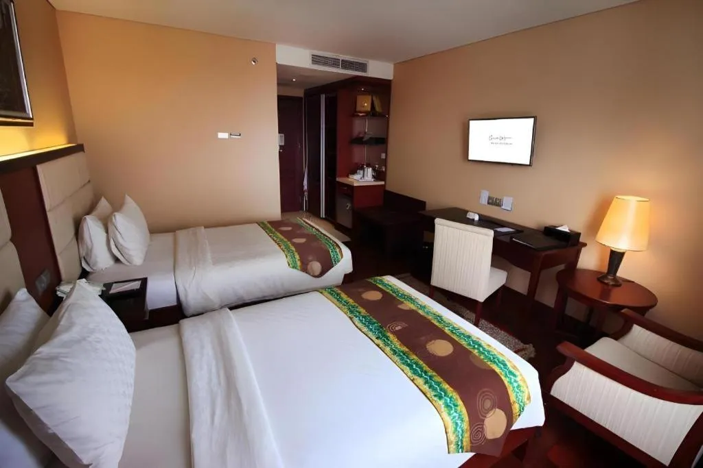 Bed in Grand Qin Hotel Syariah