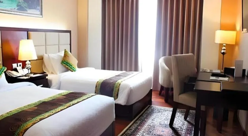 Bed in Grand Qin Hotel Syariah