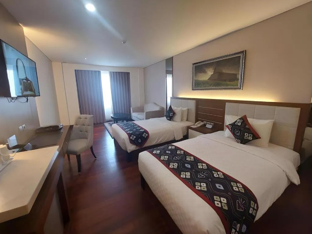 Bed in Grand Qin Hotel Syariah