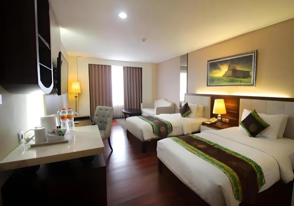 Bed in Grand Qin Hotel Syariah