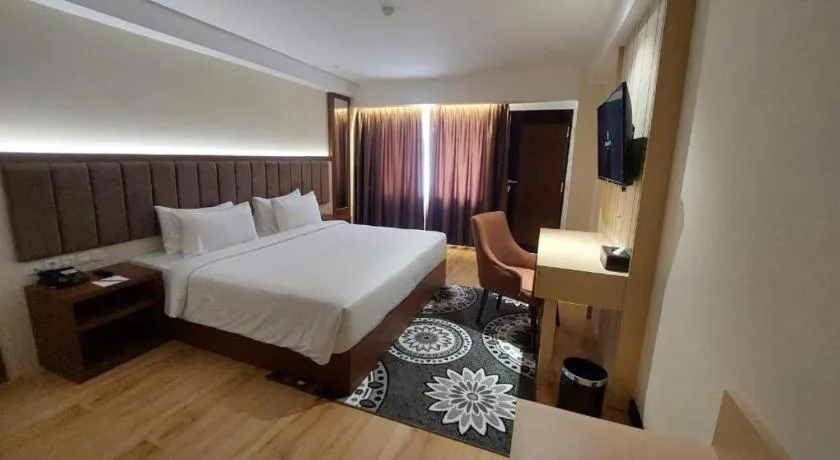Bed in Grand Qin Hotel Syariah