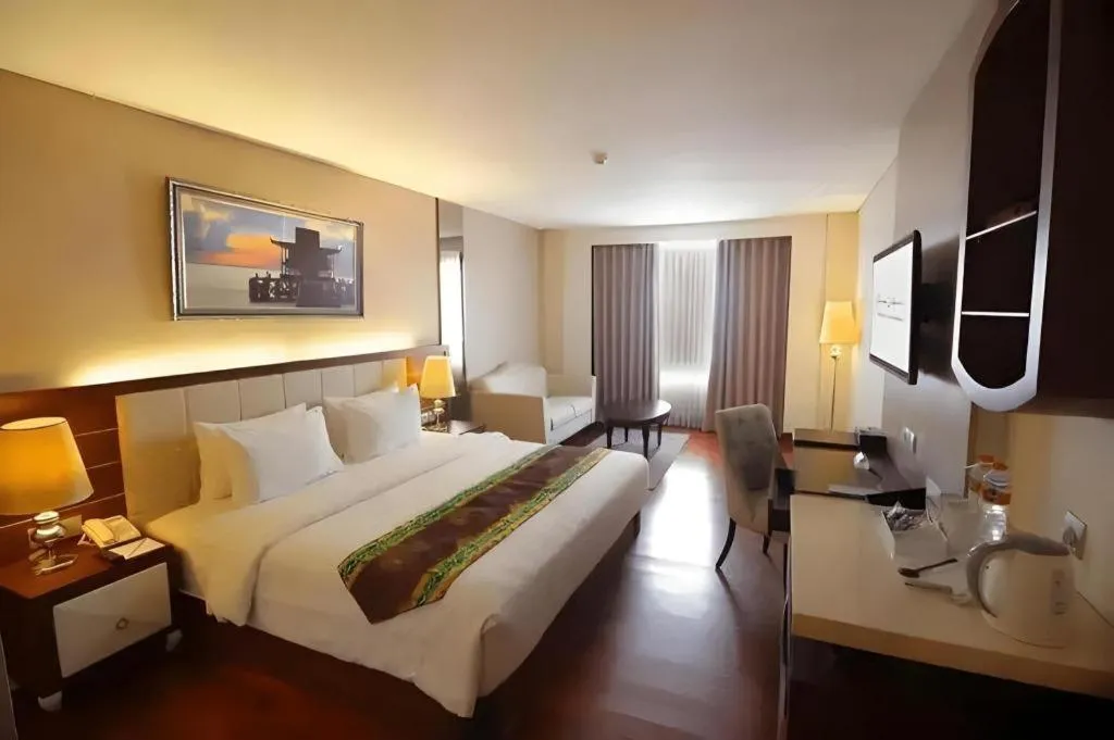 Bed in Grand Qin Hotel Syariah