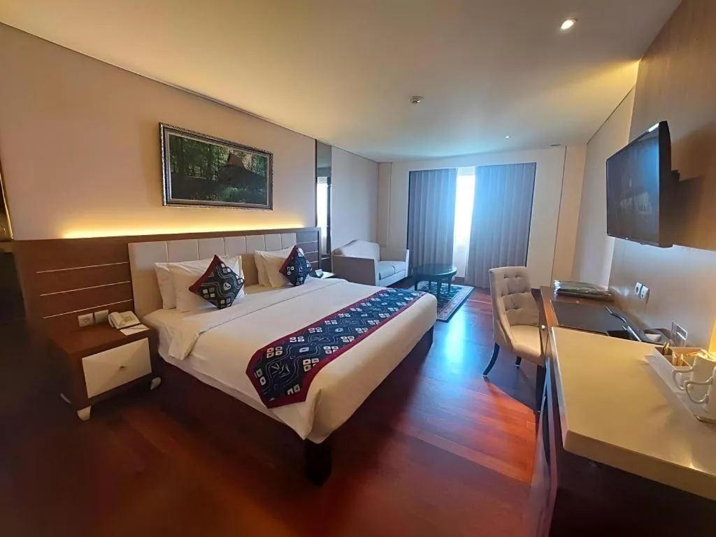 Bed in Grand Qin Hotel Syariah