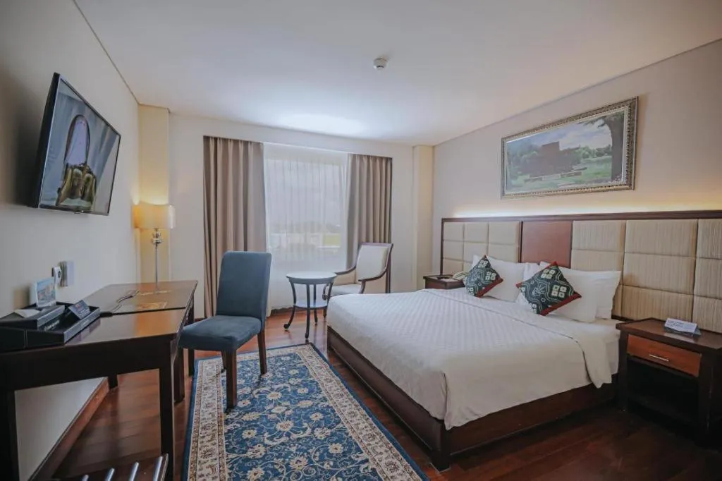 Bed in Grand Qin Hotel Syariah