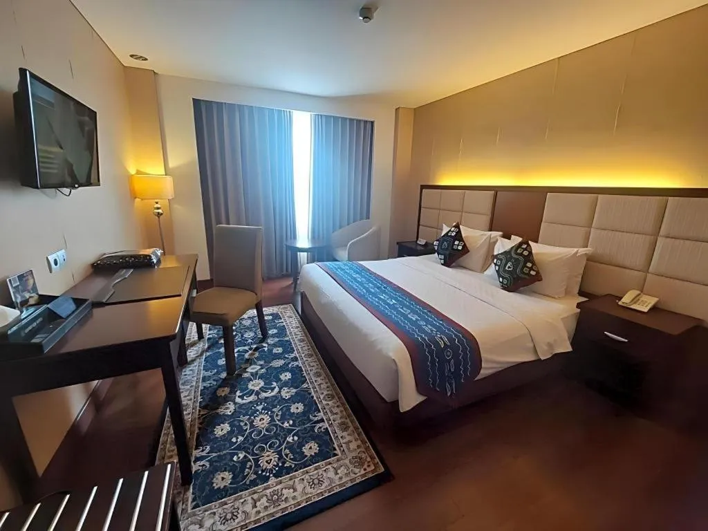 Bed in Grand Qin Hotel Syariah