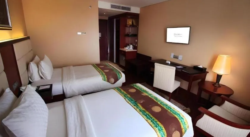 Bed in Grand Qin Hotel Syariah