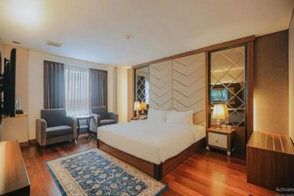 Bed in Grand Qin Hotel Syariah