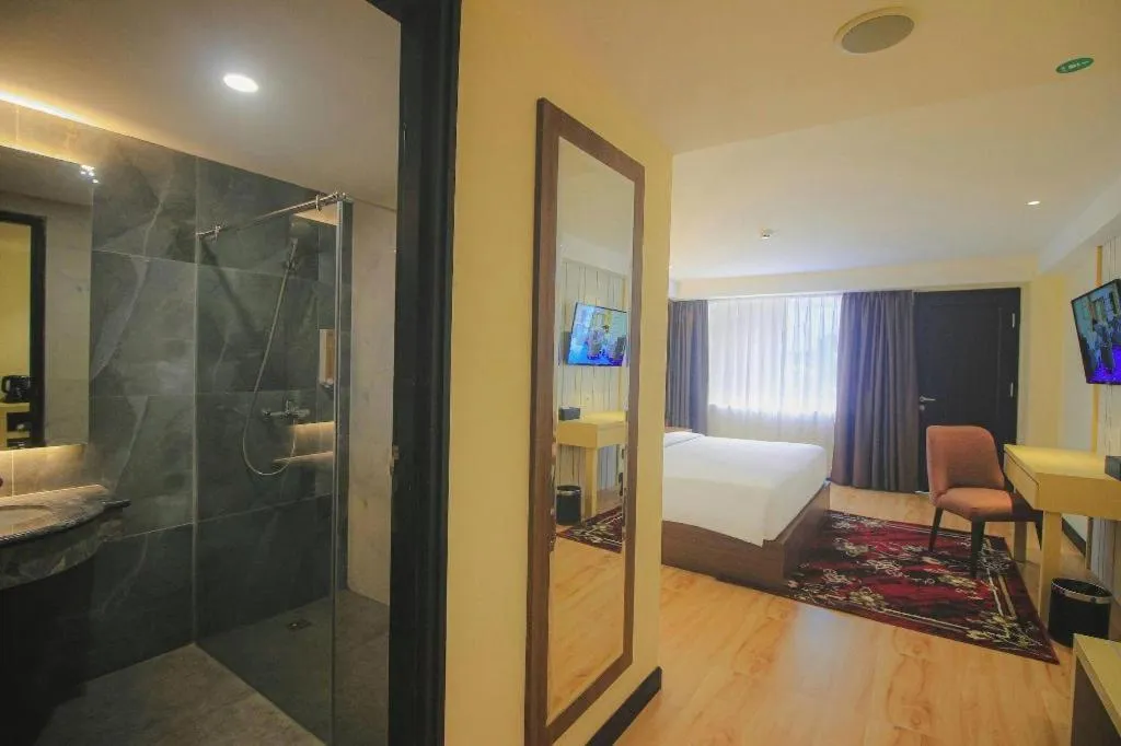 Bed in Grand Qin Hotel Syariah