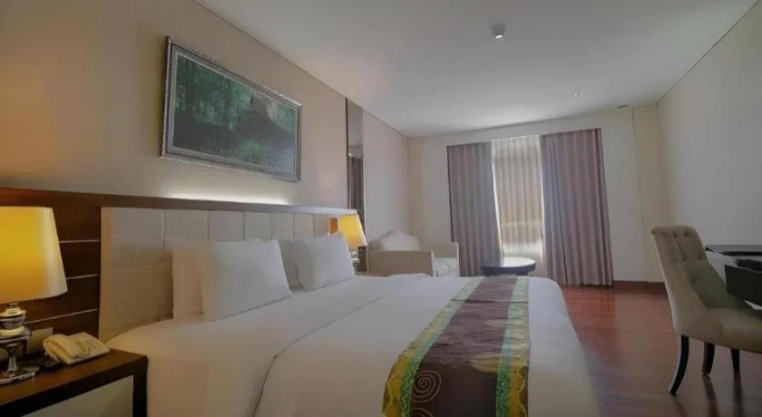 Bed in Grand Qin Hotel Syariah