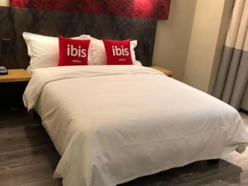 Bed in Hanting Hotel Wuxi Taihu Lake Plaza Branch