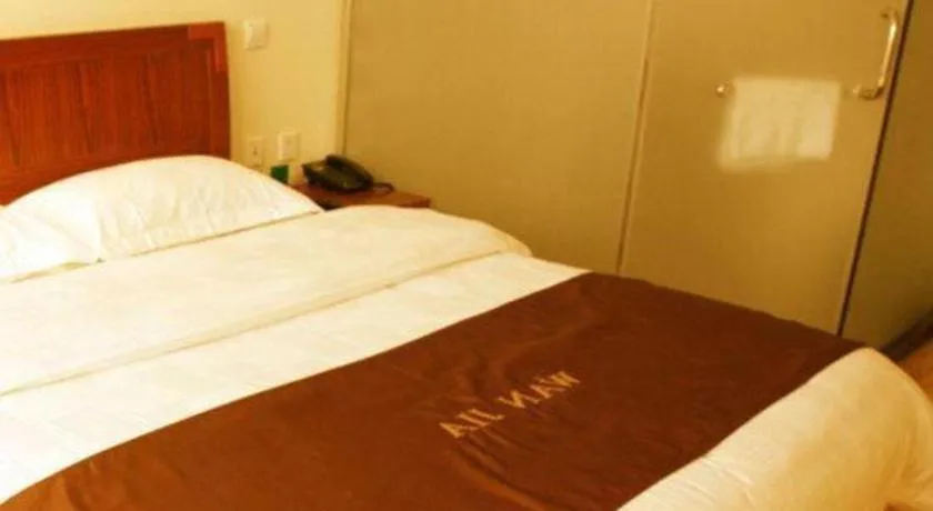 Bed in Beijing Wanjia Traders Hotel