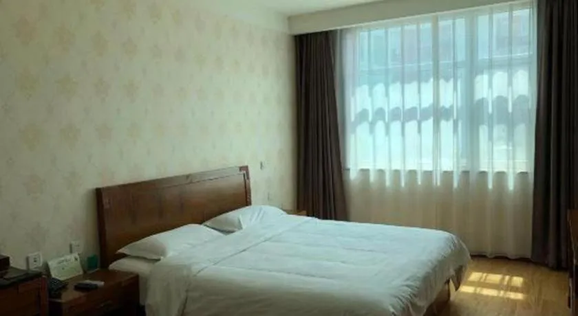 Bed in Beijing Wanjia Traders Hotel