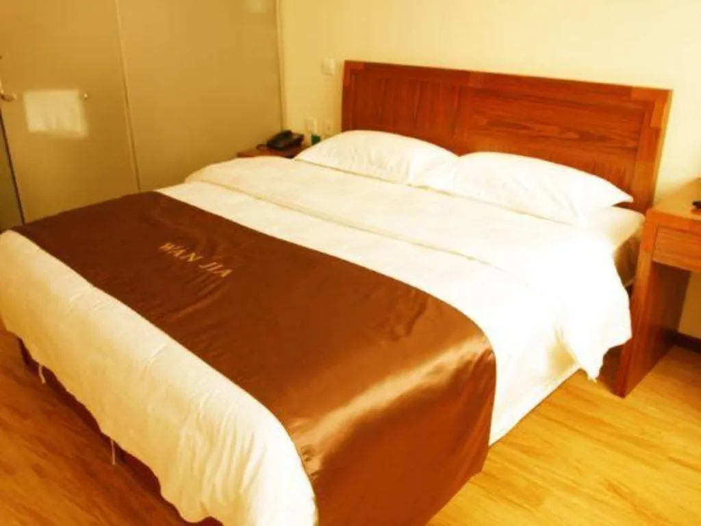 Bed in Beijing Wanjia Traders Hotel