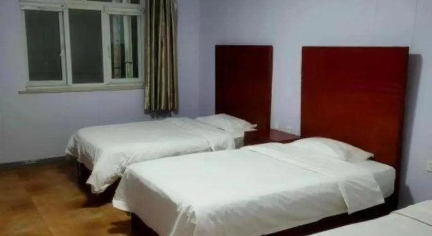 Bed in Beijing Wanjia Traders Hotel