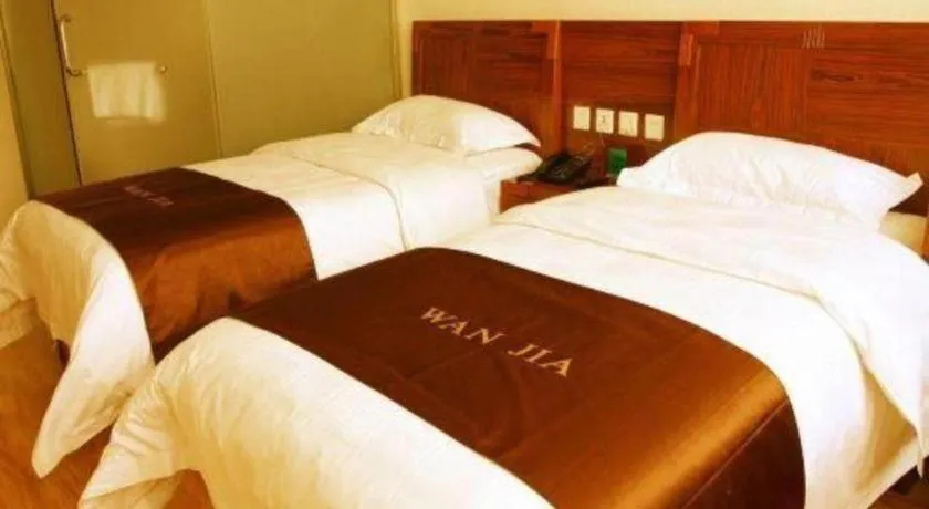 Bed in Beijing Wanjia Traders Hotel