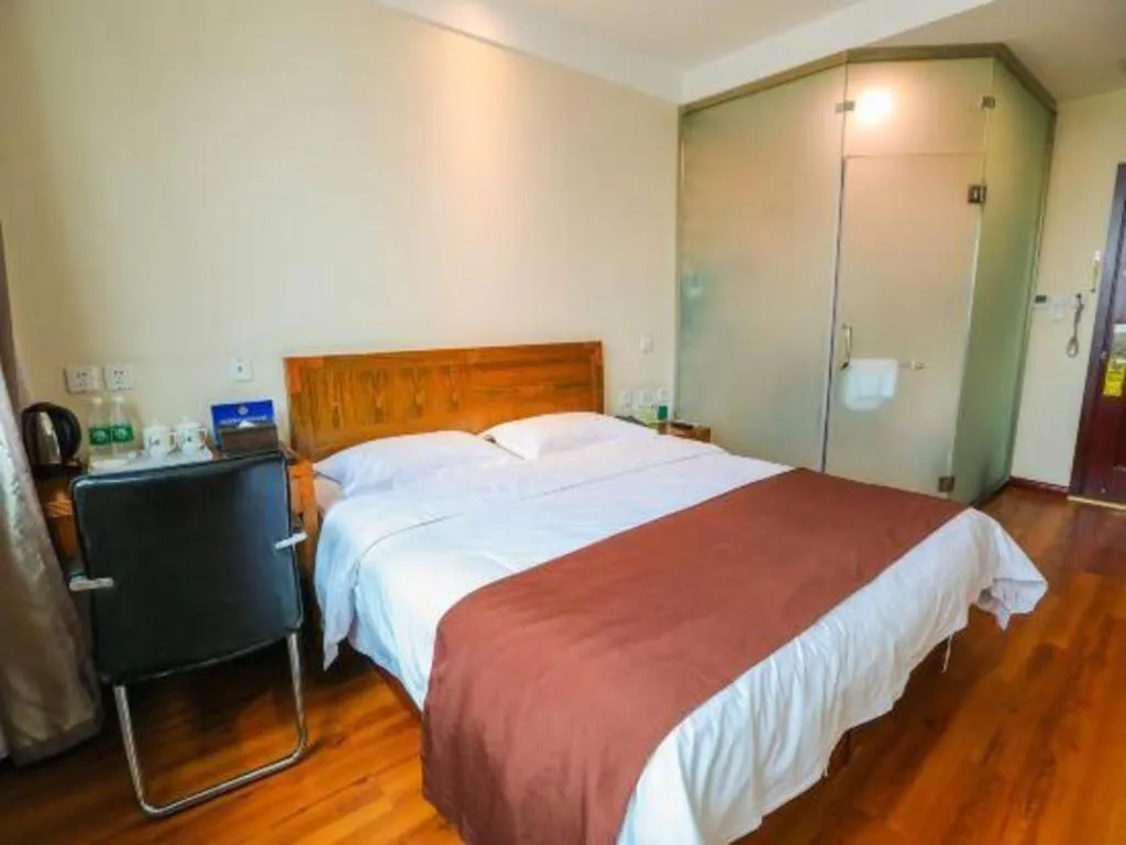 Bed in Beijing Wanjia Traders Hotel