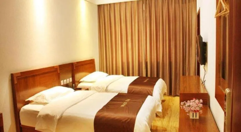 Bed in Beijing Wanjia Traders Hotel