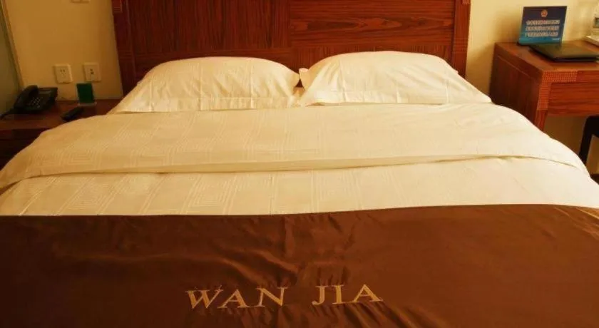 Bed in Beijing Wanjia Traders Hotel