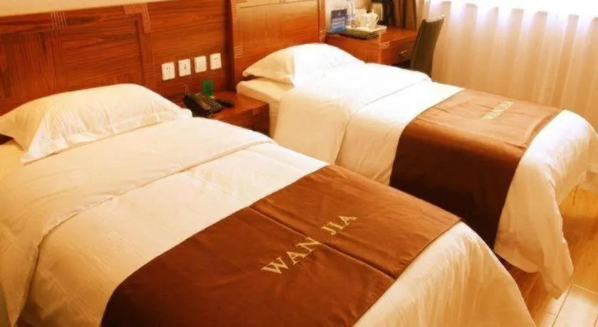 Bed in Beijing Wanjia Traders Hotel