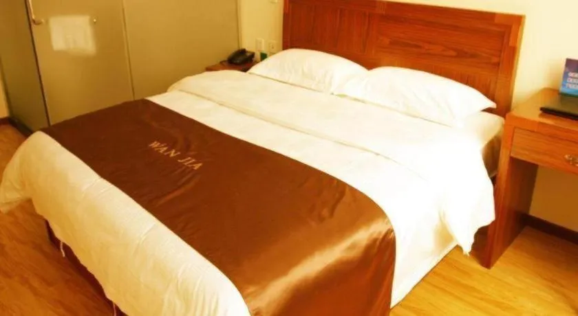 Bed in Beijing Wanjia Traders Hotel
