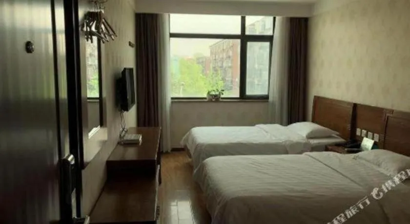 Bed in Beijing Wanjia Traders Hotel