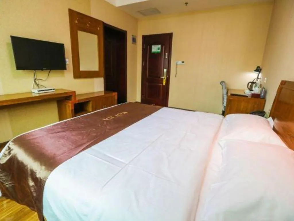 Bed in Beijing Wanjia Traders Hotel