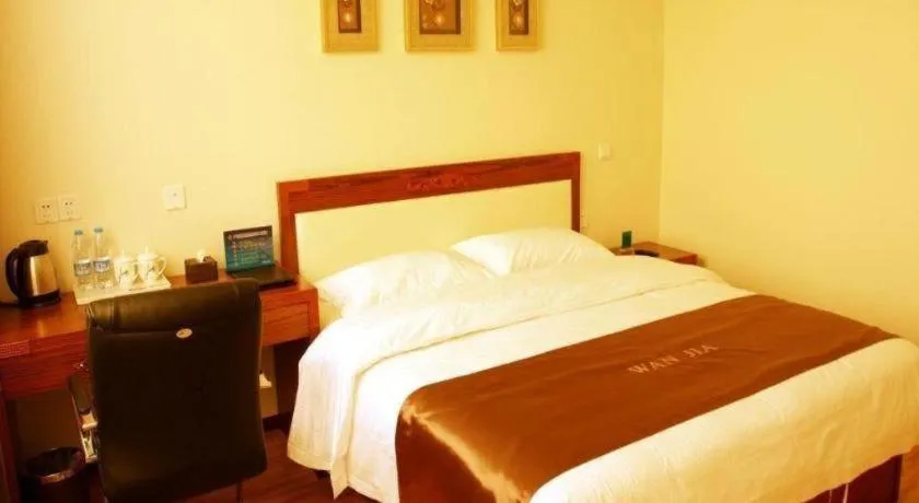 Bed in Beijing Wanjia Traders Hotel