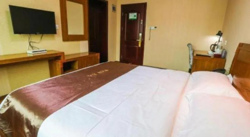 Bed in Beijing Wanjia Traders Hotel