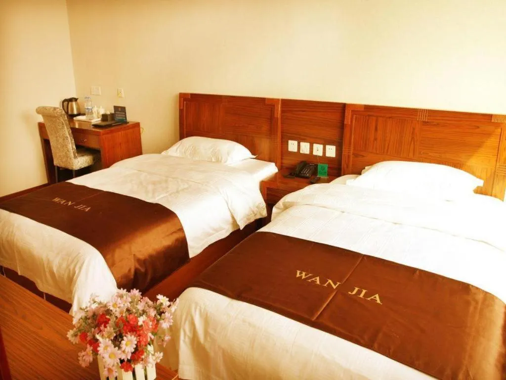 Bed in Beijing Wanjia Traders Hotel