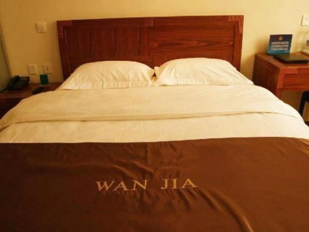 Bed in Beijing Wanjia Traders Hotel