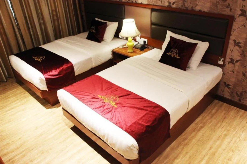 Bed in Metro Winner Hotel