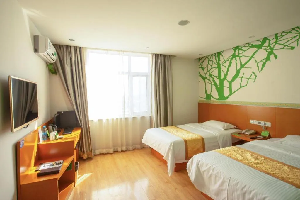 Bed in Vatica Tianjin Jinghai Bus Station Home World Plaza Hotel