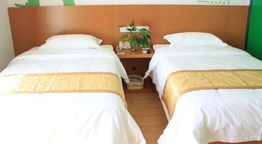 Bed in Vatica Tianjin Jinghai Bus Station Home World Plaza Hotel