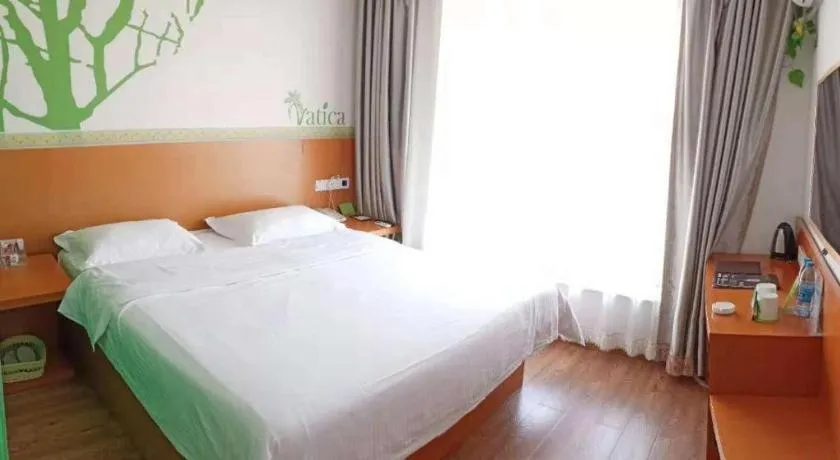 Bed in Vatica Tianjin Jinghai Bus Station Home World Plaza Hotel