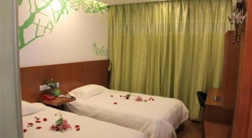 Bed in Vatica Tianjin Jinghai Bus Station Home World Plaza Hotel