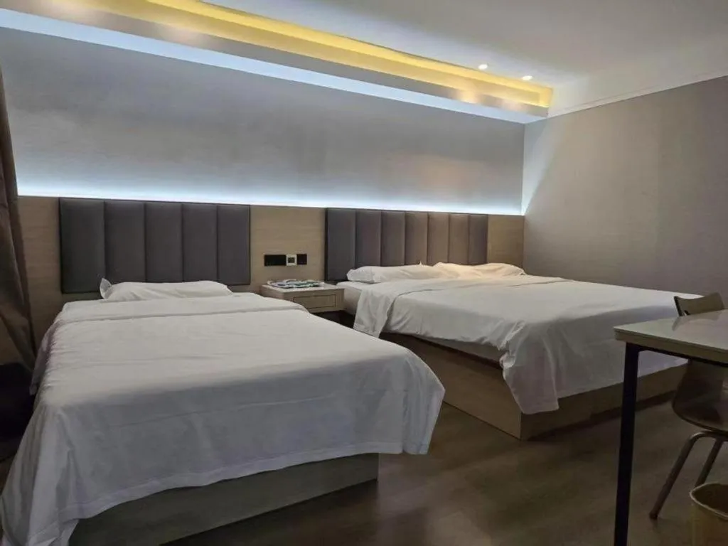 Bed in Vatica Tianjin Jinghai Bus Station Home World Plaza Hotel