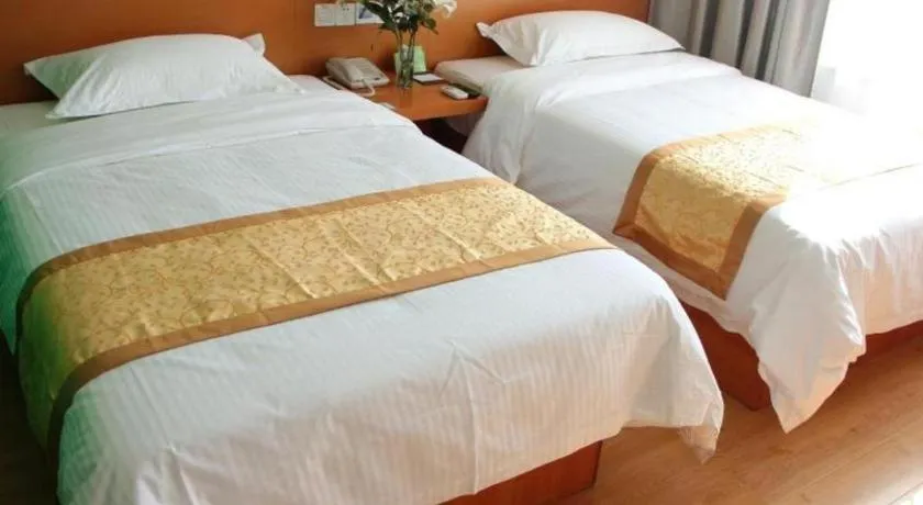 Bed in Vatica Tianjin Jinghai Bus Station Home World Plaza Hotel